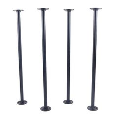 three black metal poles are standing next to each other