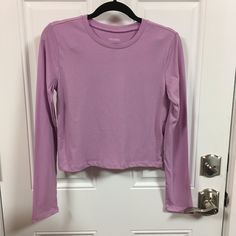 Wild Fable Long Sleeve Cropped T-Shirt Nwt Color = Lilac Streak Choose Size Measurements Approx Size Xsmall Pit To Pit = 16" Sleeve Length = 23 1/2" Back To Bottom Length = 17" Size Medium Pit To Pit = 17 1/2" Sleeve Length = 23 1/2" Back To Bottom Length = 18" All Items Come From A Smoke Free / Pet Free Home Purple Stretch Crew Neck Top, Plain Purple Top For Spring, Purple Relaxed Fit Long Sleeve Top, Purple Long Sleeve Relaxed Fit Top, Casual Purple Long Sleeve Top, Spring Purple Crew Neck Top, Purple Crew Neck Top For Spring, Purple Long Sleeve Top For Loungewear, Purple Stretch Tops For Loungewear