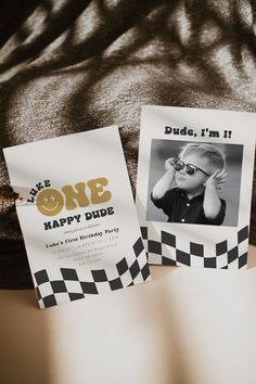 two pieces of paper that say one happy dude and another has a photo on it