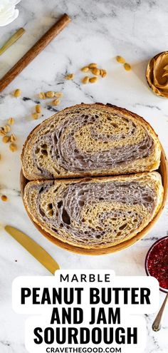 two peanut butter and jam sourdoughs sitting on top of a marble counter