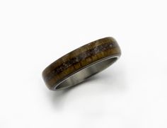 TAGS : Raw stone Ring, Marriage ring, Husband gift, Sister gift, Man Jewlery, Titanium man ring, Anniversary gift, Stone inlayed ring, Promise wood ring, dinosaur fossil ring, petrified bone gift, fossil dino ring, Teak wood ring RING SPECIFICATION: METAL: High-grade Titanium (5 and 6 grade) FITTING: Standard INLAY: Dinosaur fossil bone , petrified WOOD: Teak SIZE: 5 to 16 US WIDTH : 4 to 12 mm The ring pictured measures 6 mm in width We do all sizes for men and women US/Canada scale from 3 to 1 Dino Ring, Ring Marriage, Wedding Band Men, Fossil Ring, Damascus Ring, Dinosaur Fossil, Titanium Rings For Men, Fossil Bones, Marriage Ring