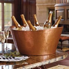 there are many bottles of champagne in the ice bucket