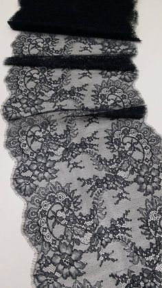 three pieces of black lace on top of each other