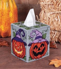 a tissue box with two pumpkins on it