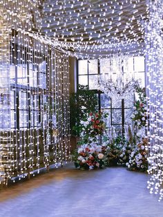 the room is decorated with lights and flowers