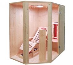 a wooden sauna with two chairs inside it