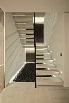 a modern staircase in the middle of a room