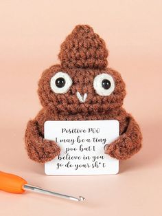 a crocheted brown owl holding a sign with the words positive pro i may be a tiny poo but i believe you'll give you 99 to see yourself