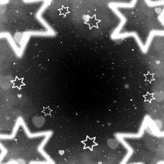 black and white stars are in the middle of a circular pattern on a dark background