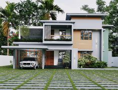 a car is parked in front of a two story house