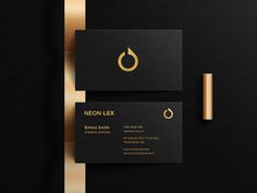 black business card with gold foil on the edges and an elegant logo design for a jewelry store