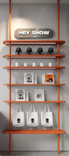 an orange shelf filled with bags and pictures