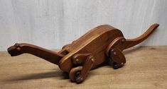 a wooden toy rocking horse on a table