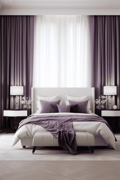 a large bed sitting in front of two lamps on either side of a window with purple drapes