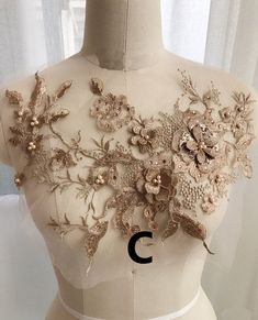 the back of a dress with flowers on it