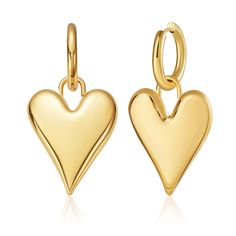 PRICES MAY VARY. Fashionable&Classic Earrings: Gold heart earrings are very playful and cute,high-polished real gold plated earrings with a very textured look, making the wearer look confident and radiant. Is very good to modify our face when these gold earrings swing in the sun. Comfortable to Wear: Drop earrings with an inner diameter of 0.55 inches and a height of 1.97 inches, each single dantiy earring weighs 8g. It's lightweight comfort to wear, the closure is Huggie type, they are easy to Gold Studs Earrings, Gold Finger Rings, Gold Heart Bracelet, Gold Heart Earring, Buy Pearls, Chunky Earrings, Nickel Free Earrings, Classic Earrings, Heart Dangle Earrings