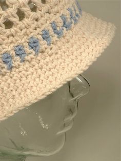 Lightweight cotton crochet sun hat. Open mesh crown, loose, contrast color headband offers a cool fit on hot days. Flexible sunshade brim. Crush to pack up.  Summer Bucket blend #1206, solid ecru with a bluestone detail band. Also shown in #1219 in Sage and Java, and in #1212 in Whitefish, and String, a different blend of blue and natural string. Also pictured #1207 White/Blue, #1214 Taupe/Ecru, #1513 coordinating adult/baby hats, and in Robin Egg Blue. This hat is available in a wide array of c Crochet Sun, Crochet Sun Hat, Robin Egg Blue, Summer Bucket, Cool Fits, Robins Egg Blue, Cotton Crochet, Hot Days, Summer Cotton