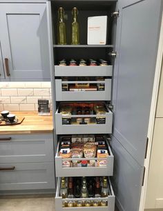 an organized pantry in the corner of a kitchen