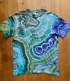 Beautiful and bright hand dyed geode tie dye T-shirt! Soft and stretchy cotton T-shirt. Perfect for concerts, festivals, workout or every day. Unisex size Large. Artistic Tie-dye Summer Tops, Hand Dyed Acid Wash T-shirt For Festivals, Tie-dye Crew Neck T-shirt For Festivals, Tie Dye Crew Neck T-shirt For Festival, Bohemian Hand Dyed Crew Neck T-shirt, Hippie Hand Dyed Tie Dye T-shirt, Hand Dyed Hippie Short Sleeve T-shirt, Hippie Tie Dye T-shirt For Festivals, Hippie Hand Dyed Festival T-shirt