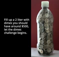 a bottle filled with money sitting on top of a table