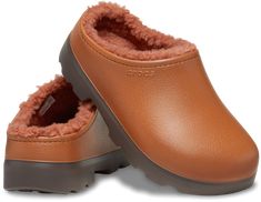 Crocs Unisex Dylan Lined Clogs Cognac W7/M6. A modern and sophisticated alternative to the Classic Lined Clog, the Dylan Lined Clog offers cozy comfort in a stylish mule-style shoe. Made to mimic the look of genuine, full-grain leather mules, this lined version of the Dylan also features a rugged outsole for enhanced traction and versatility. Whether you’re lounging around home or running around town, you’ll enjoy the modern casual style, blissful comfort and great functionality. Dylan Lined Clog Details: * • Cozy lining for added comfort and warmth * • Rugged outsole provides enhanced traction and versatility * • Subtle texture on synthetic upper mimics the appearance of genuine, full-grain leather * • Deep heel cup for extra comfort and improved fit * • Single-piece molded Croslite™ for Subtle Textures, Leather Mules, Comforters Cozy, Full Grain Leather, Mule, Cognac, Casual Style, Clogs, Fashion Shoes