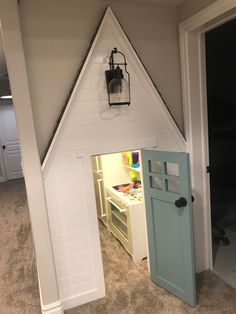 a child's play house with a door open