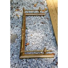 an old fashioned bed frame laying on the ground