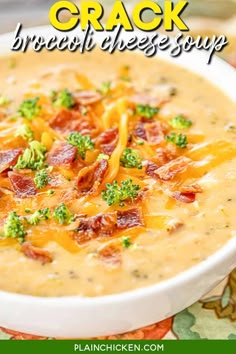 a white bowl filled with broccoli and cheese soup on top of a table