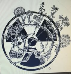 a computer screen with an image of skulls and flowers in the center, on top of it