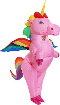 an inflatable pink unicorn costume with rainbow wings and tail, standing on one leg