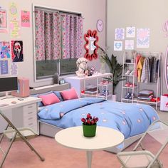 the bedroom is decorated in pastel colors and features pink, blue, and white accessories