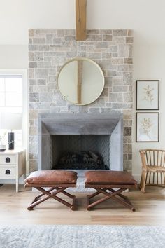 the living room is clean and ready for us to use it's fireplace as a focal point