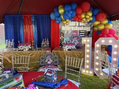 a birthday party with balloons and decorations