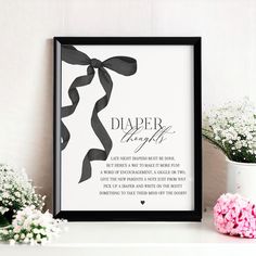 a black and white framed poster with a ribbon saying diaper is the best gift