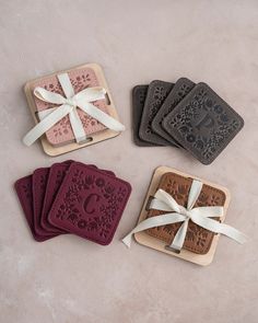 four coasters with bows tied around them