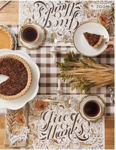 a table topped with pies and cups of coffee next to each other on top of a checkered table cloth