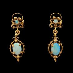 A pair of vintage 14k yellow gold and Opal cabochon dangle earrings. SE1414 Weight: 3.60 grams (Inclusive of all materials) Opal (2) Round & (2) Oval Cabochons Stone Measurements: 2.37 - 7.27 x 5.10 mm Sapphire And Diamond Band, Opal Ring Gold, Cabochon Ring, Jewel Box, Victorian Jewelry, Sapphire Earrings, Opal Earrings, Etsy Earrings Dangle, Sapphire Diamond