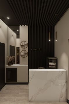 a white marble counter top sitting inside of a kitchen