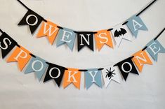 two halloween buntings hanging on a wall with the words swens and spooky one