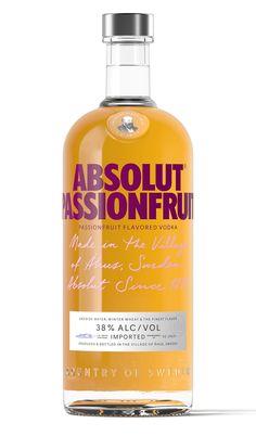 a bottle of absolut passionfruit on a white background