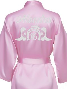 Elevate your Sweet 16 celebration with our exquisite Pink and Silver Robe, designed to make you feel like the star of the show! This stunning robe features a soft pink hue beautifully complemented by elegant silver accents, perfect for any glamorous occasion. Each robe is fully personalized, adding a unique touch that showcases your individuality. Whether for getting ready or as a stylish accessory during the festivities, this robe is a must-have for your special day! Includes : RobeAll the item Elegant Pink Bridesmaid Robe, Pink Long Sleeve Wedding Robe, Pink Fitted Robe For Wedding Night, Pink Fitted Long Sleeve Robe, Fitted Long Sleeve Pink Robe, Pink Satin Party Robe, Pink And Silver, Silver Accents, Quinceanera