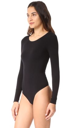 Long Sleeve Stretch Bodysuit With Smoothing Details, Long Sleeve Second-skin Smoothing Bodysuit, Solid Seamless Long Sleeve Bodysuit, Seamless Second-skin Long Sleeve Bodysuit, Solid Long Sleeve Seamless Bodysuit, High Stretch Seamless Long Sleeve Bodysuit, Seamless High Stretch Long Sleeve Bodysuit, Seamless Long Sleeve High Stretch Bodysuit, Sleek Long Sleeve Bodysuit With Minimal Stretch