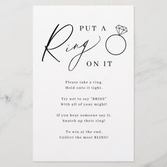 a white card with black ink that says put a ring on it and an image of a diamond