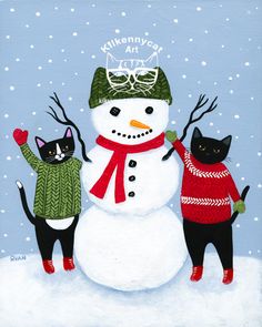 two cats are standing next to a snowman