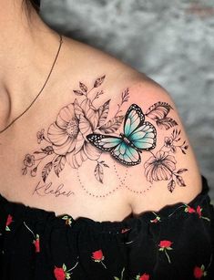 a woman with a butterfly tattoo on her shoulder