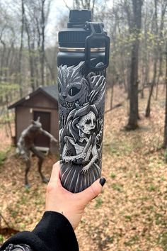 a person holding up a water bottle with a drawing on it in front of a horse