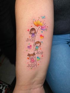 a woman with a tattoo on her arm that says 2009 and two girls holding flowers