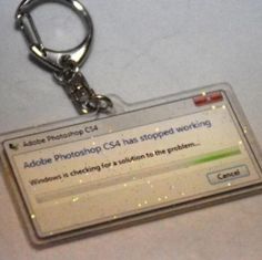 a clear plastic keychain that has an image of a computer screen on it