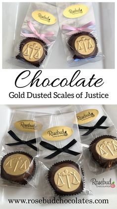 some chocolates are in the packaging with gold letters on them and ribbons tied around them