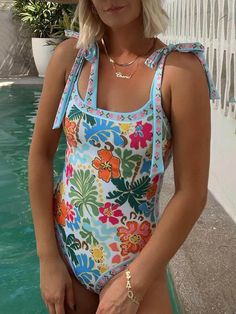 Make a splash in our Floral Unique Print Tie-Up Shoulder One-Piece Swimsuit. This stylish swimsuit features a vibrant floral print and a trendy tie-up detail at the shoulders, adding a touch of chic charm to your beach look. The stretchy fabric ensures a comfortable and flattering fit, while the one-piece design provides coverage and support. Whether you're lounging by the pool or hitting the waves, this swimsuit is perfect for soaking up the sun in style. See More：Beach﻿ @Note:Size: please One Piece Shorts, One Piece Bathing Suits, Shoulder Stretch, Floral One Piece, Swimming Outfit, Costume Intero, Swimming Costume, Blue Swimsuit, Midi Dress Casual